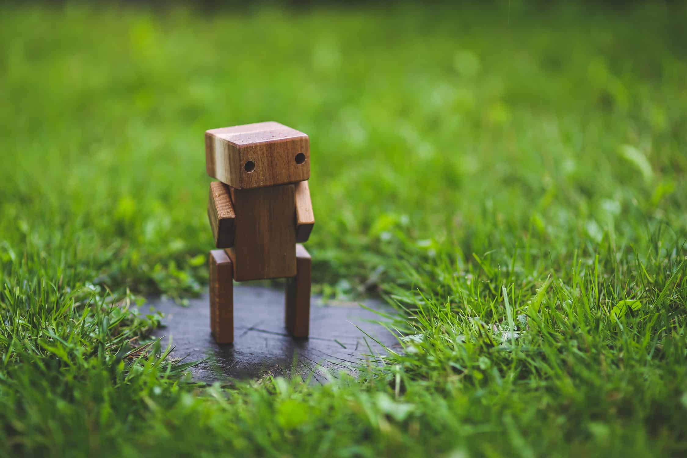A Wooden Robot Resembling A Chatbota